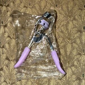 Free w/ $25 purchase. Purple Eyelash Curler
